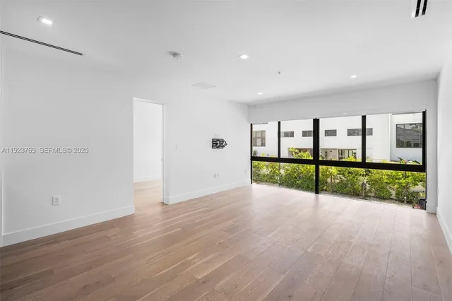a view of an room with wooden floor