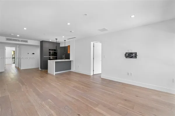 a view of kitchen with wooden floor