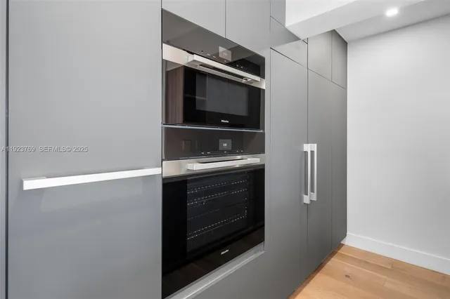 a bathroom with a sink and a microwave