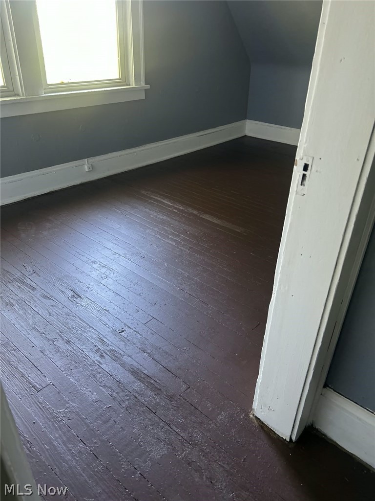 1069 Carlyon Road East Cleveland, OH 44112 - Photo 21 of 25 Wood-finish flooring with a window and white trim