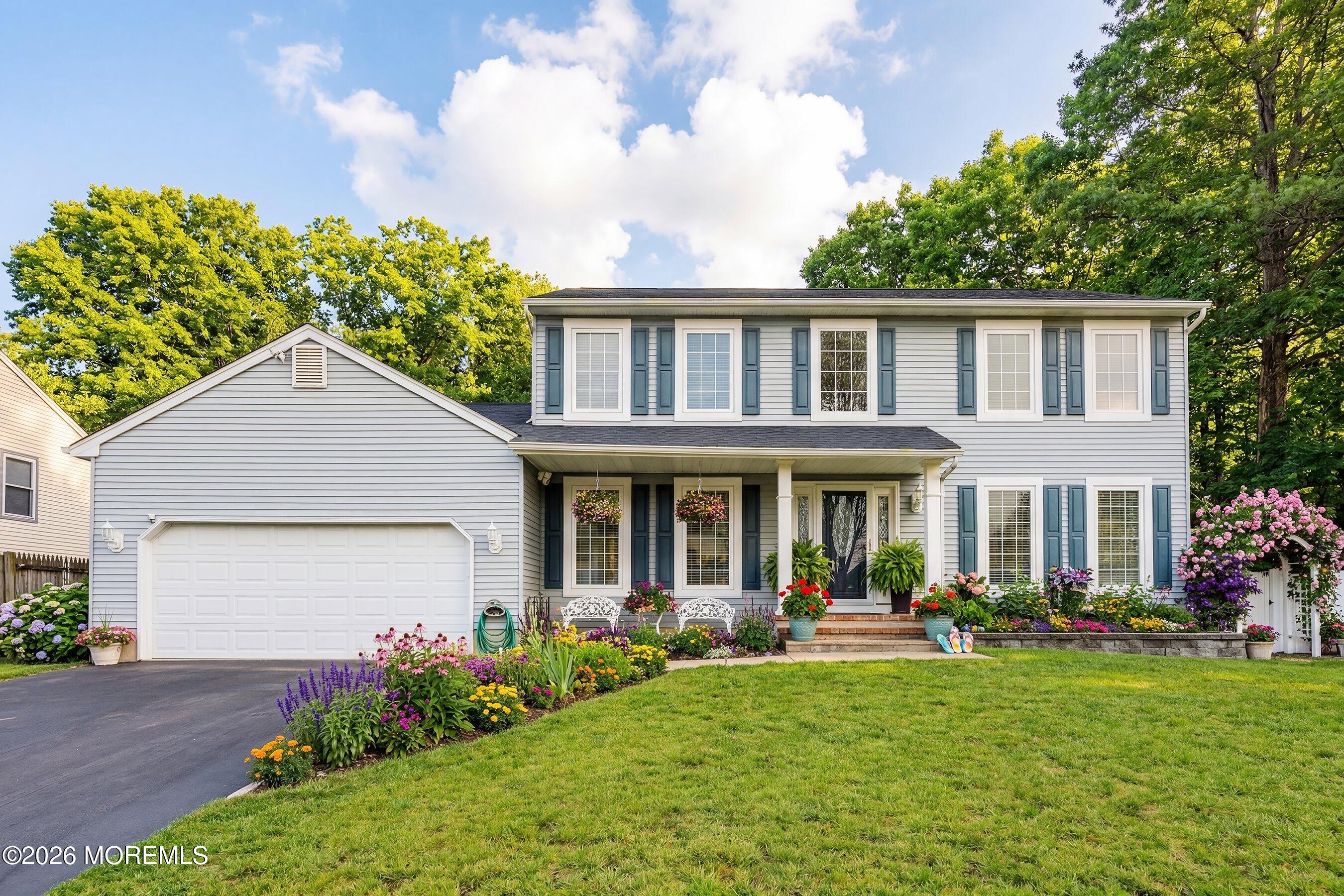 a front view of a house with garden