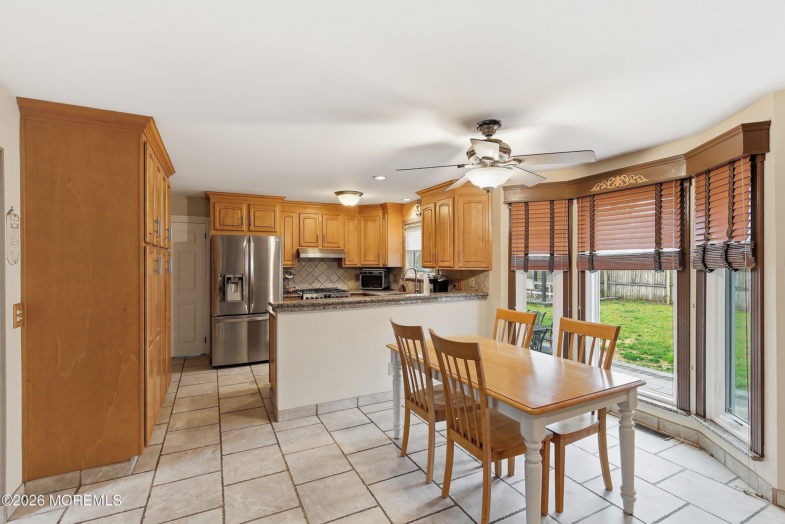 7 Metedeconk Road Howell, NJ 07731 - Photo 14 of 44 a very nice looking dining room with a large window and kitchen view