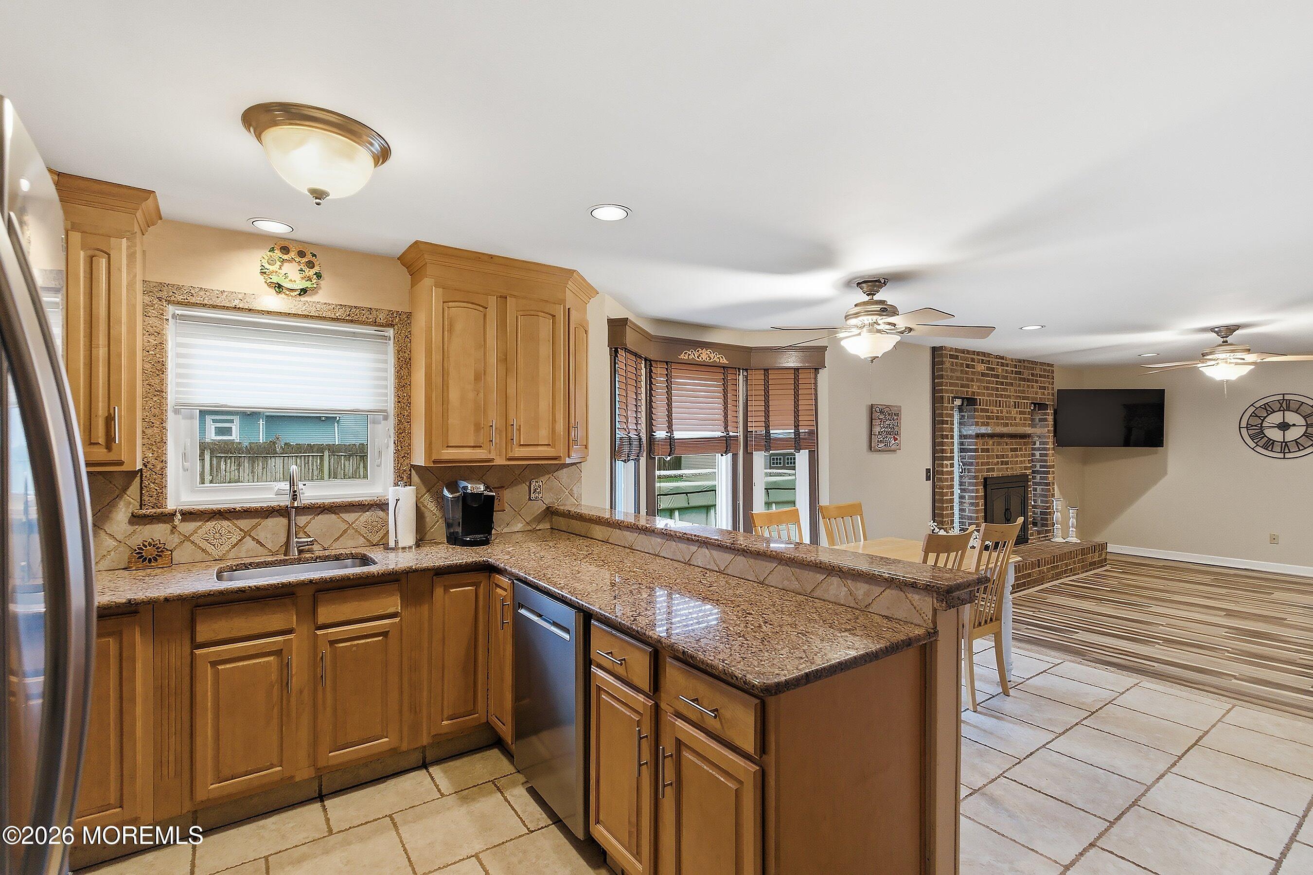 7 Metedeconk Road Howell, NJ 07731 - Photo 16 of 44 a kitchen with stainless steel appliances granite countertop a sink and cabinets