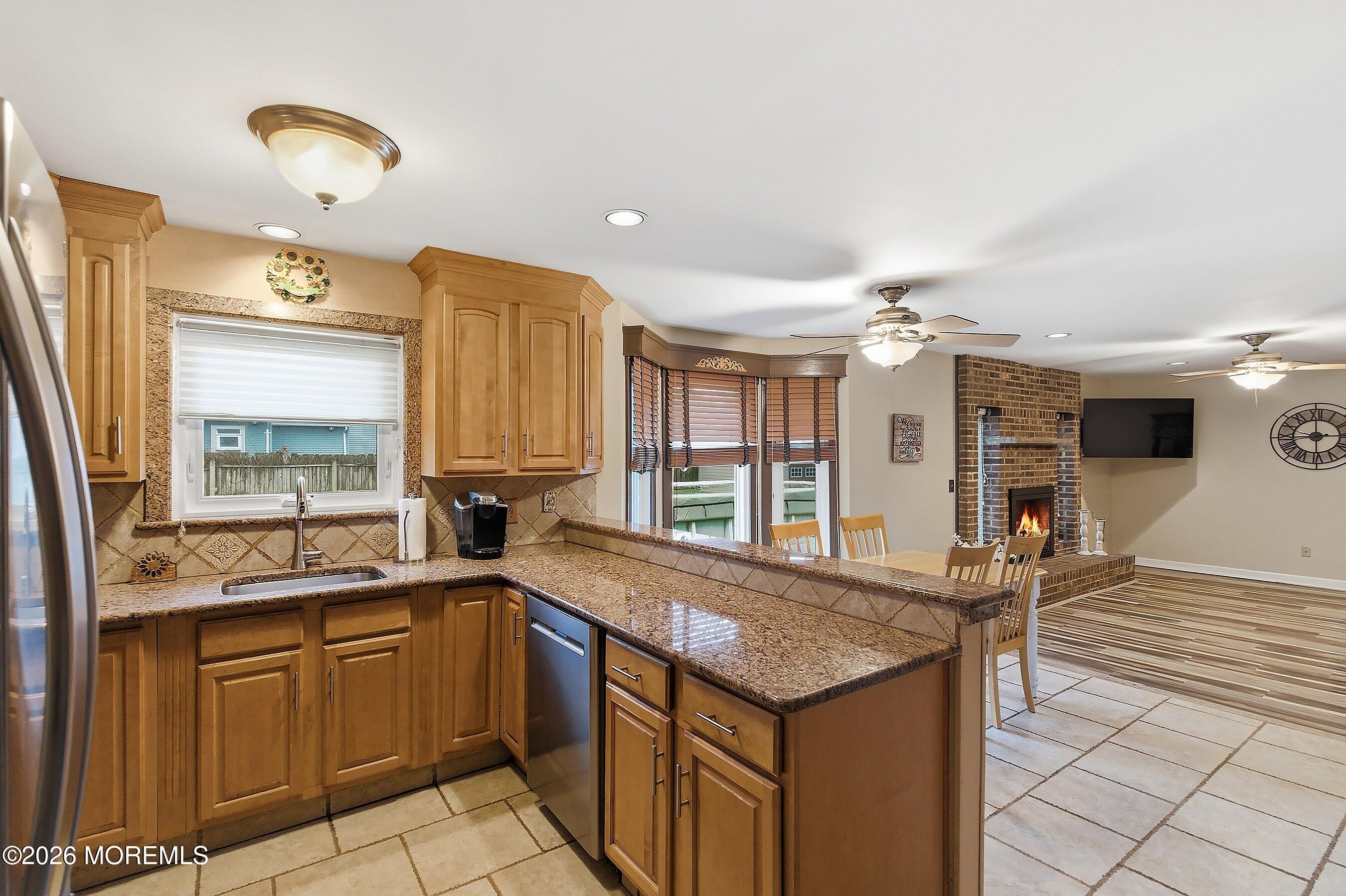 7 Metedeconk Road Howell, NJ 07731 - Photo 17 of 44 a kitchen with stainless steel appliances granite countertop a sink and cabinets