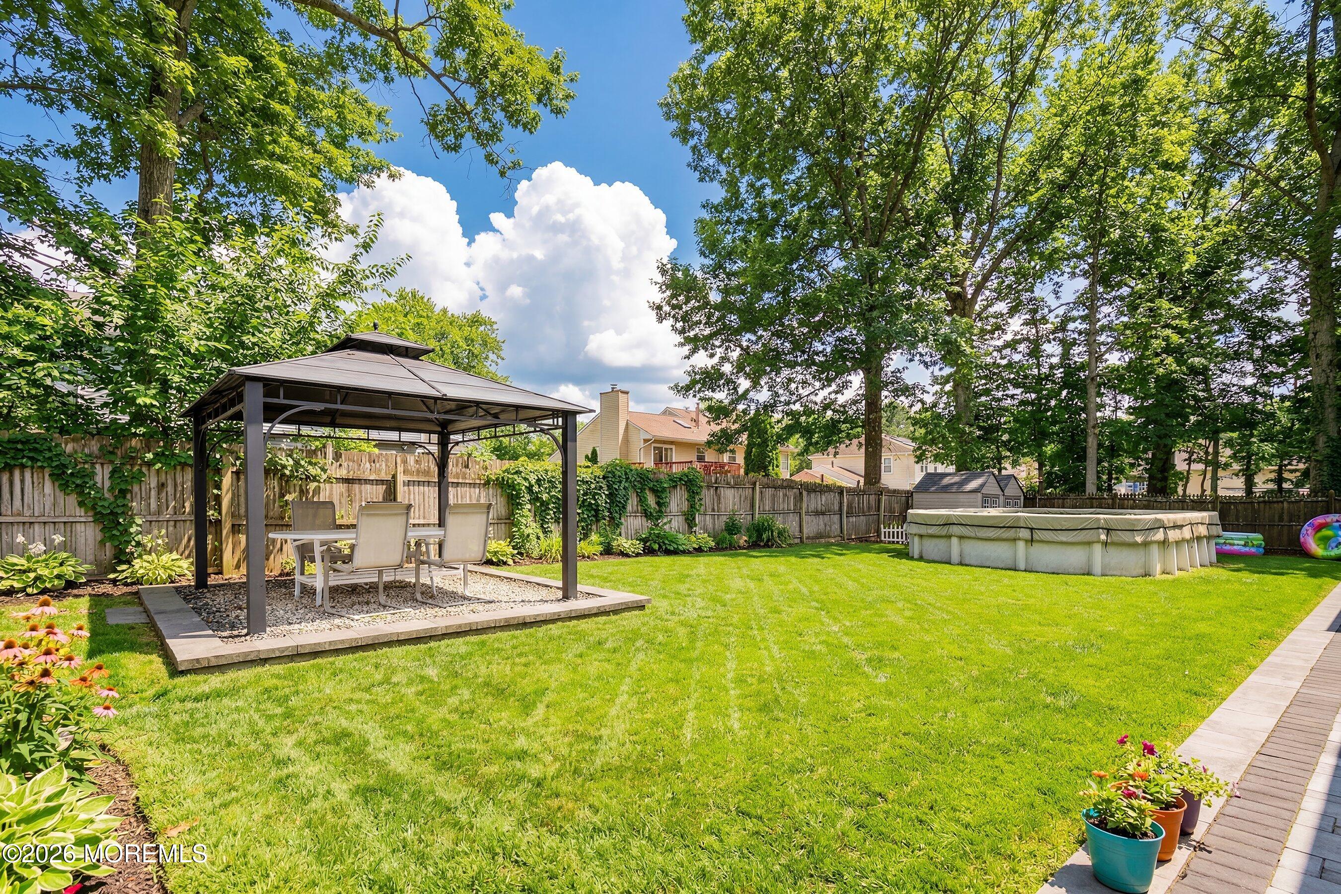 7 Metedeconk Road Howell, NJ 07731 - Photo 5 of 44 a view of a swimming pool with a patio