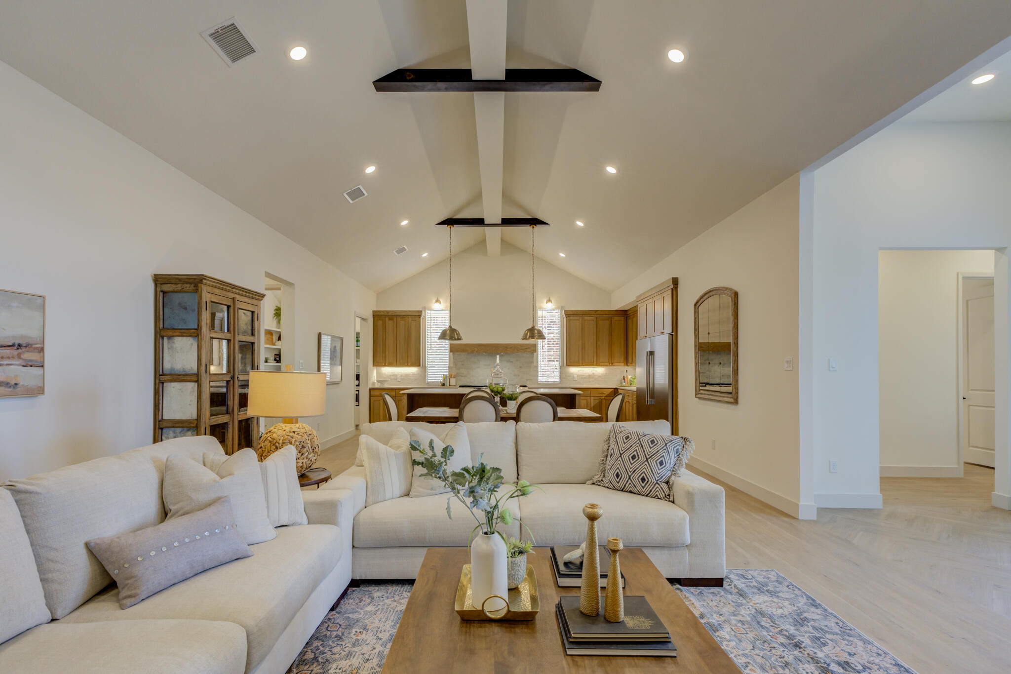 3809 126th Street Lubbock, TX 79423 - Photo 12 of 58 a living room with furniture and a chandelier