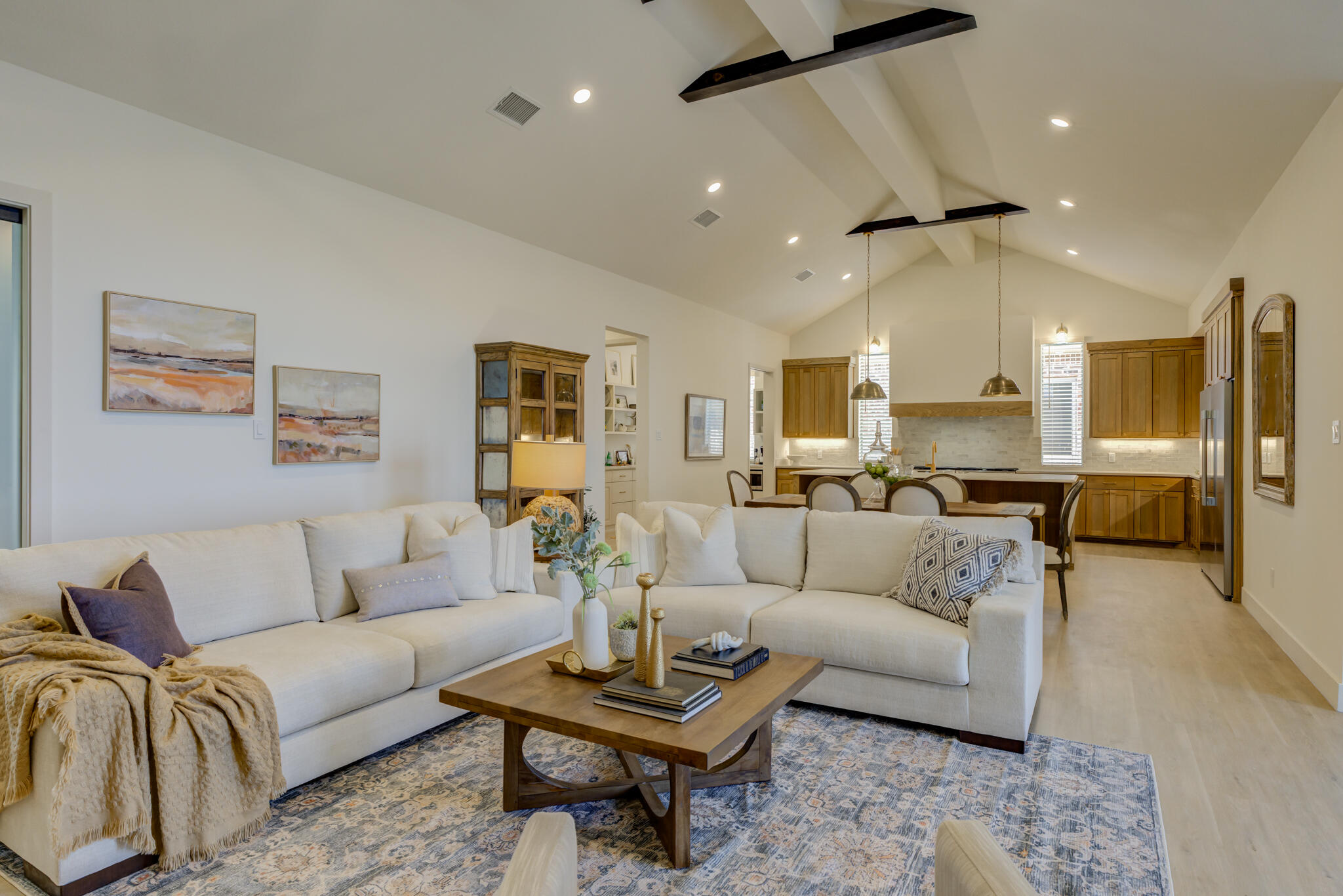 3809 126th Street Lubbock, TX 79423 - Photo 13 of 58 a living room with furniture kitchen view and a potted plant