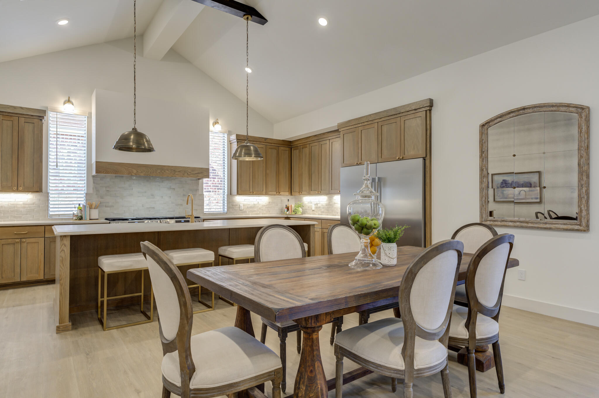 3809 126th Street Lubbock, TX 79423 - Photo 15 of 58 a kitchen with a kitchen island a table and chairs in it
