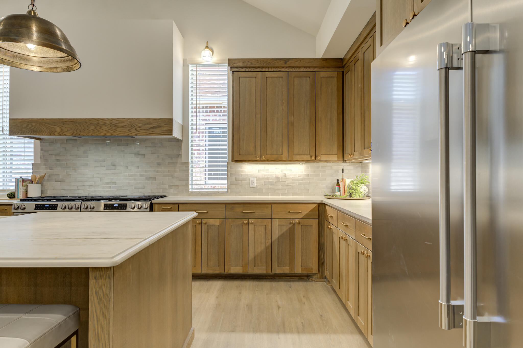 3809 126th Street Lubbock, TX 79423 - Photo 19 of 58 a kitchen with stainless steel appliances granite countertop a sink and a refrigerator