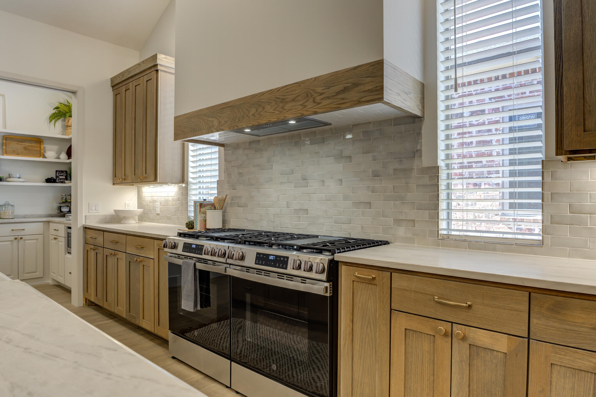 3809 126th Street Lubbock, TX 79423 - Photo 20 of 58 a kitchen with a stove and a sink