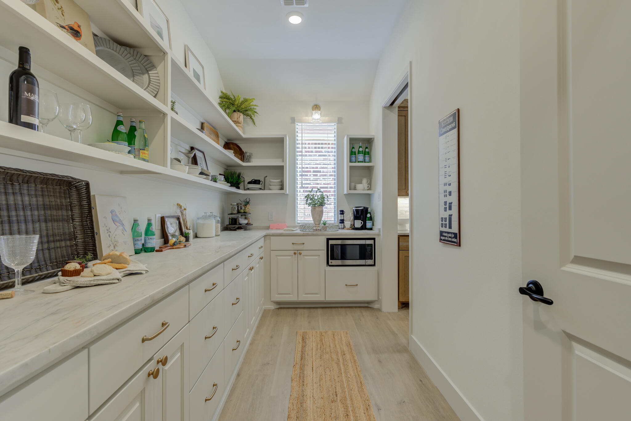3809 126th Street Lubbock, TX 79423 - Photo 28 of 58 a kitchen with stainless steel appliances kitchen island granite countertop a refrigerator and a stove top oven