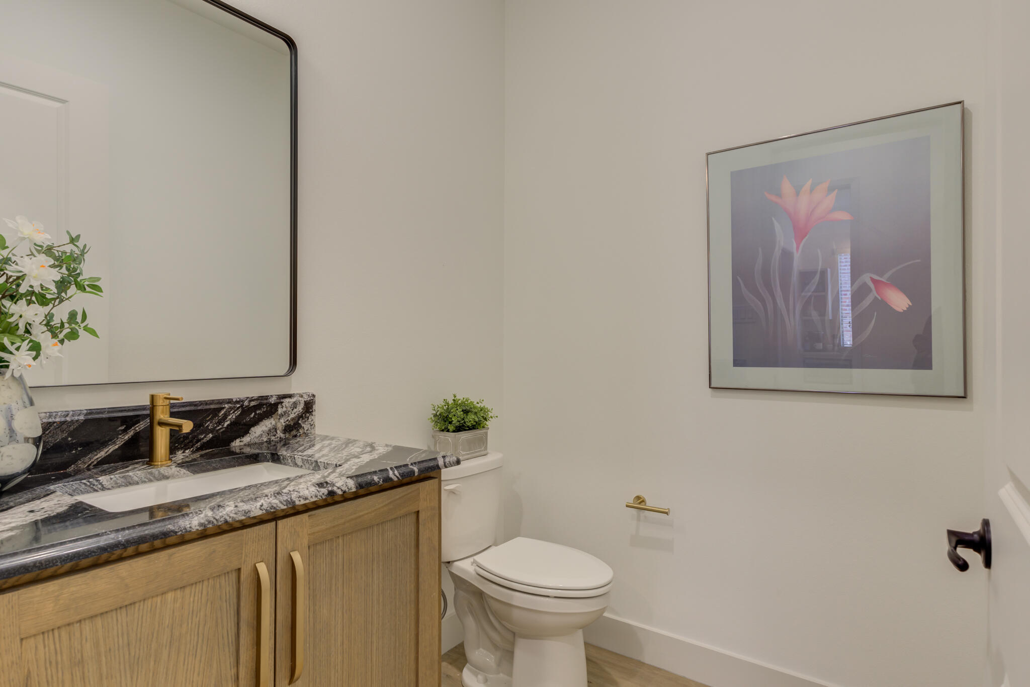 3809 126th Street Lubbock, TX 79423 - Photo 30 of 58 a bathroom with a granite countertop sink and a toilet