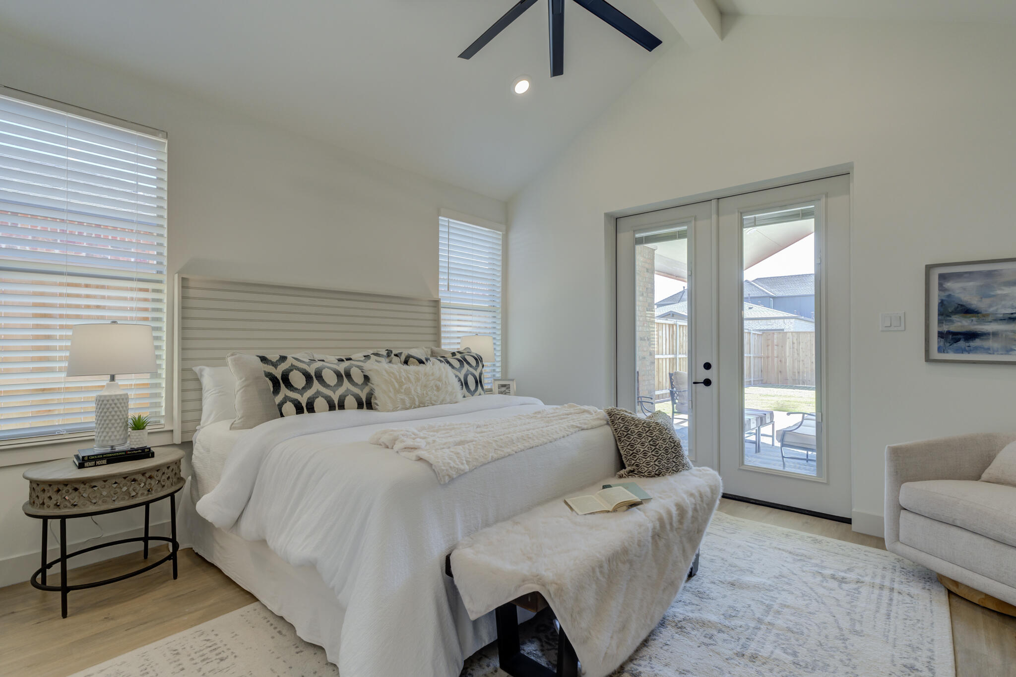 3809 126th Street Lubbock, TX 79423 - Photo 33 of 58 a spacious bedroom with a bed and a couch