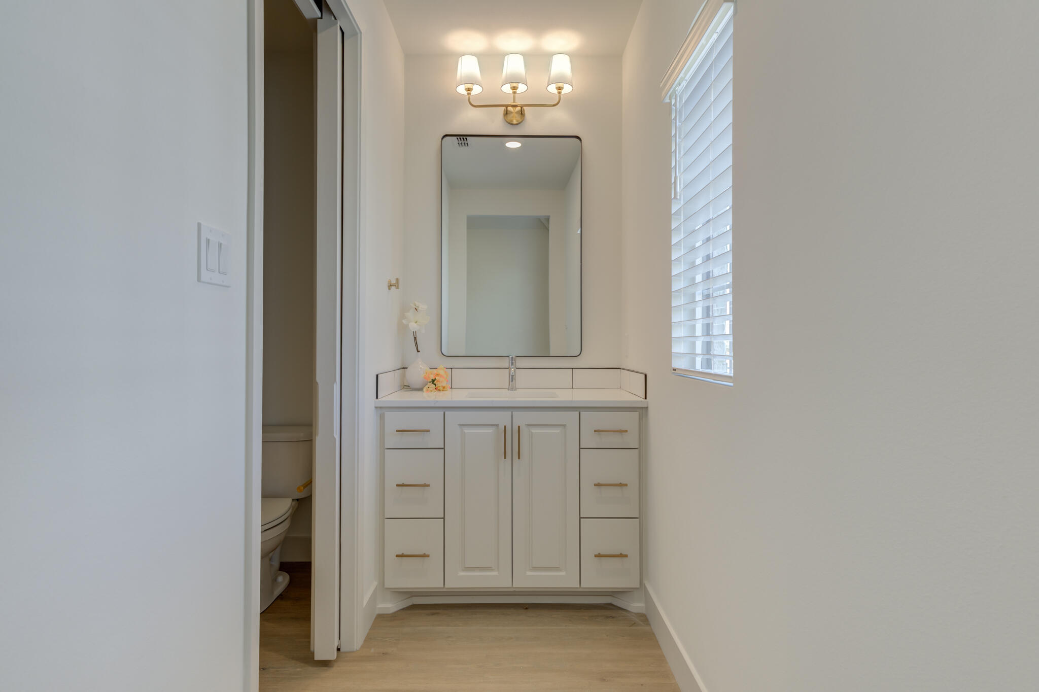 3809 126th Street Lubbock, TX 79423 - Photo 46 of 58 a bathroom with a sink and a mirror