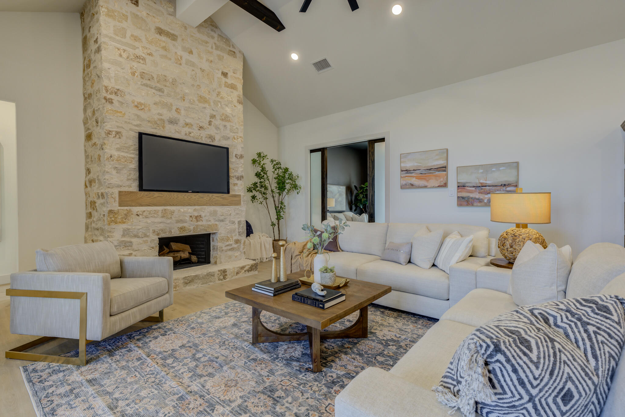 3809 126th Street Lubbock, TX 79423 - Photo 5 of 58 a living room with furniture a fireplace and a flat screen tv