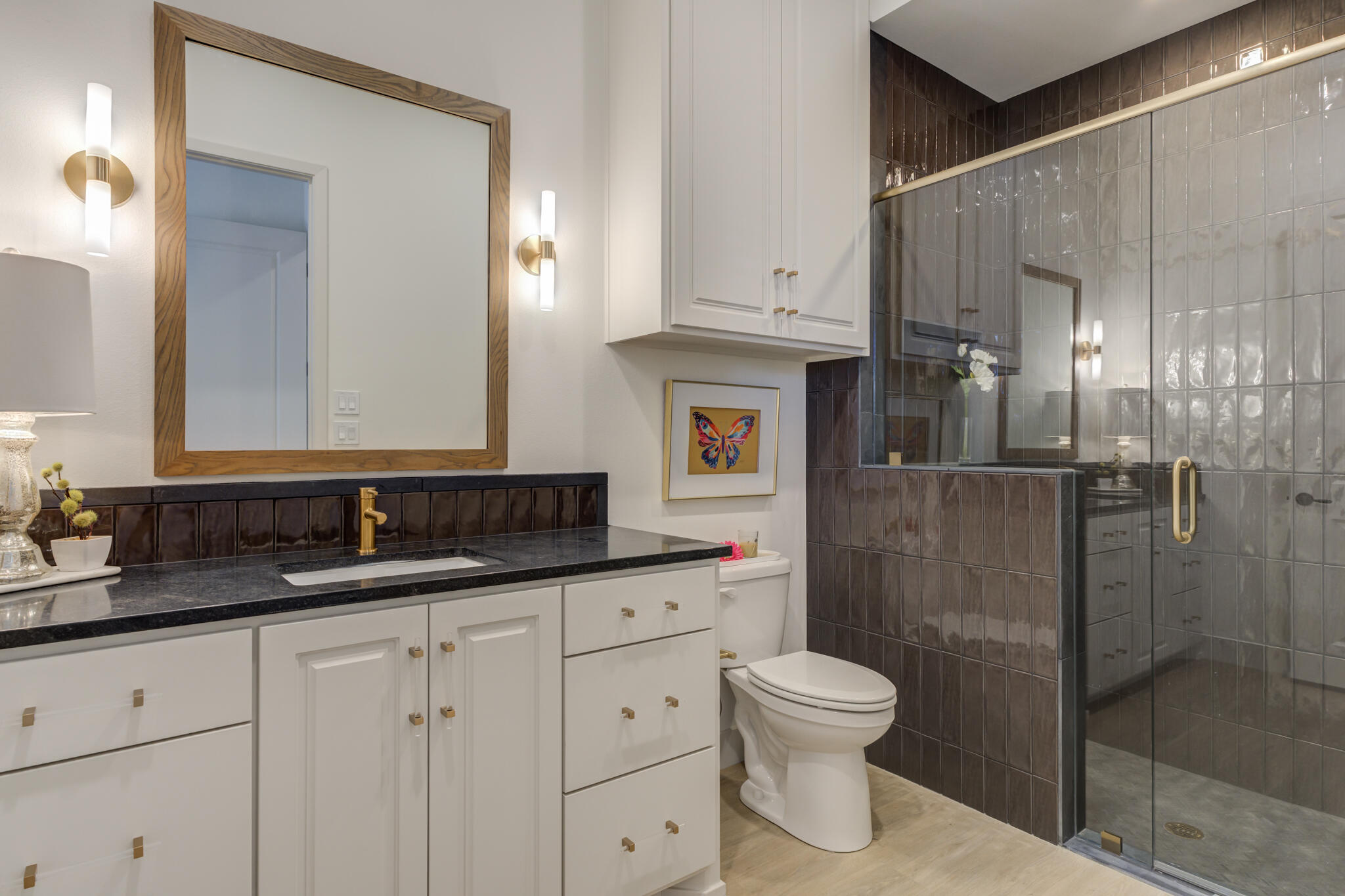 3809 126th Street Lubbock, TX 79423 - Photo 51 of 58 a bathroom with a granite countertop sink a toilet and a shower