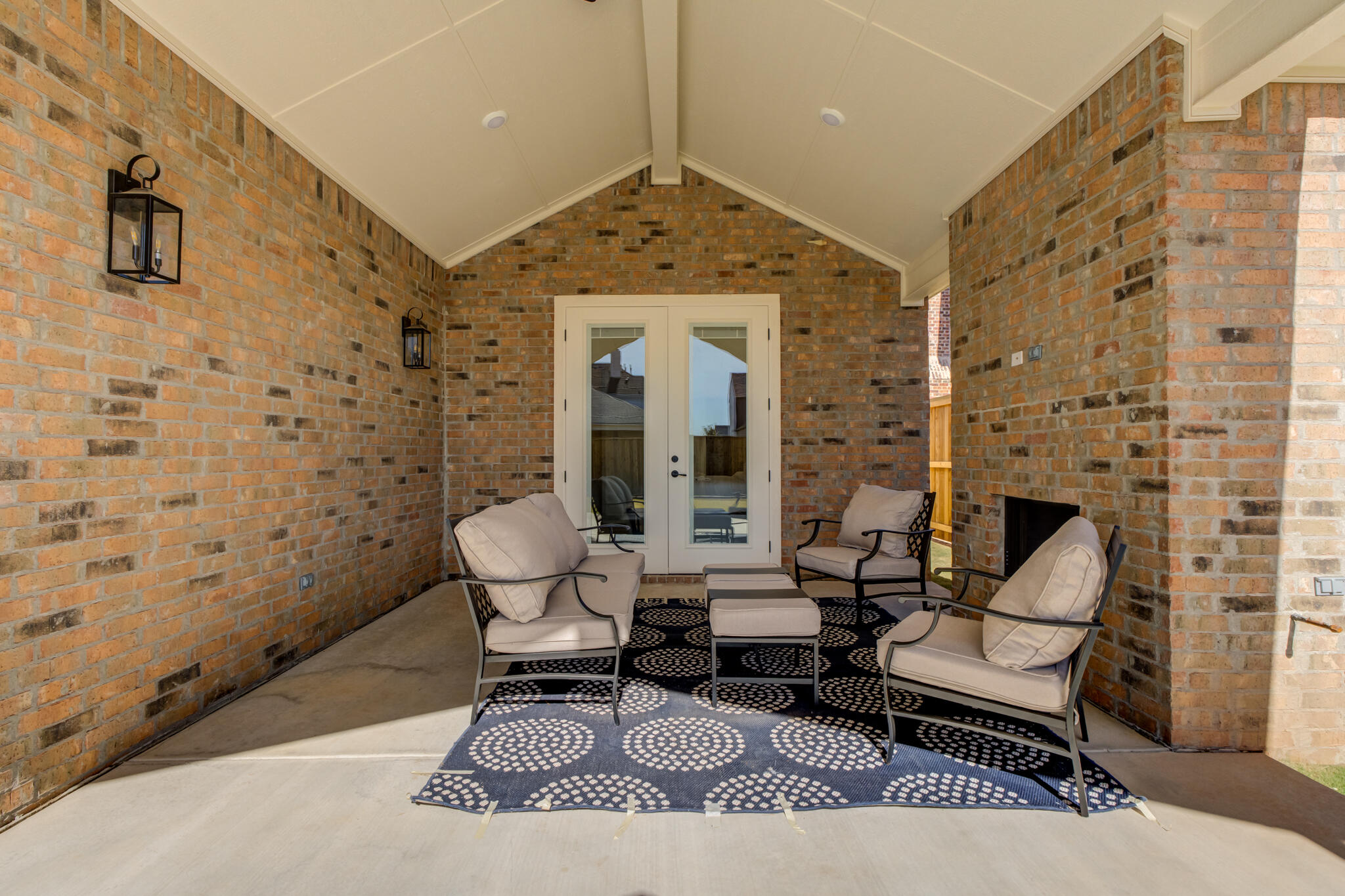 3809 126th Street Lubbock, TX 79423 - Photo 54 of 58 a living room with furniture a fireplace and a chandelier