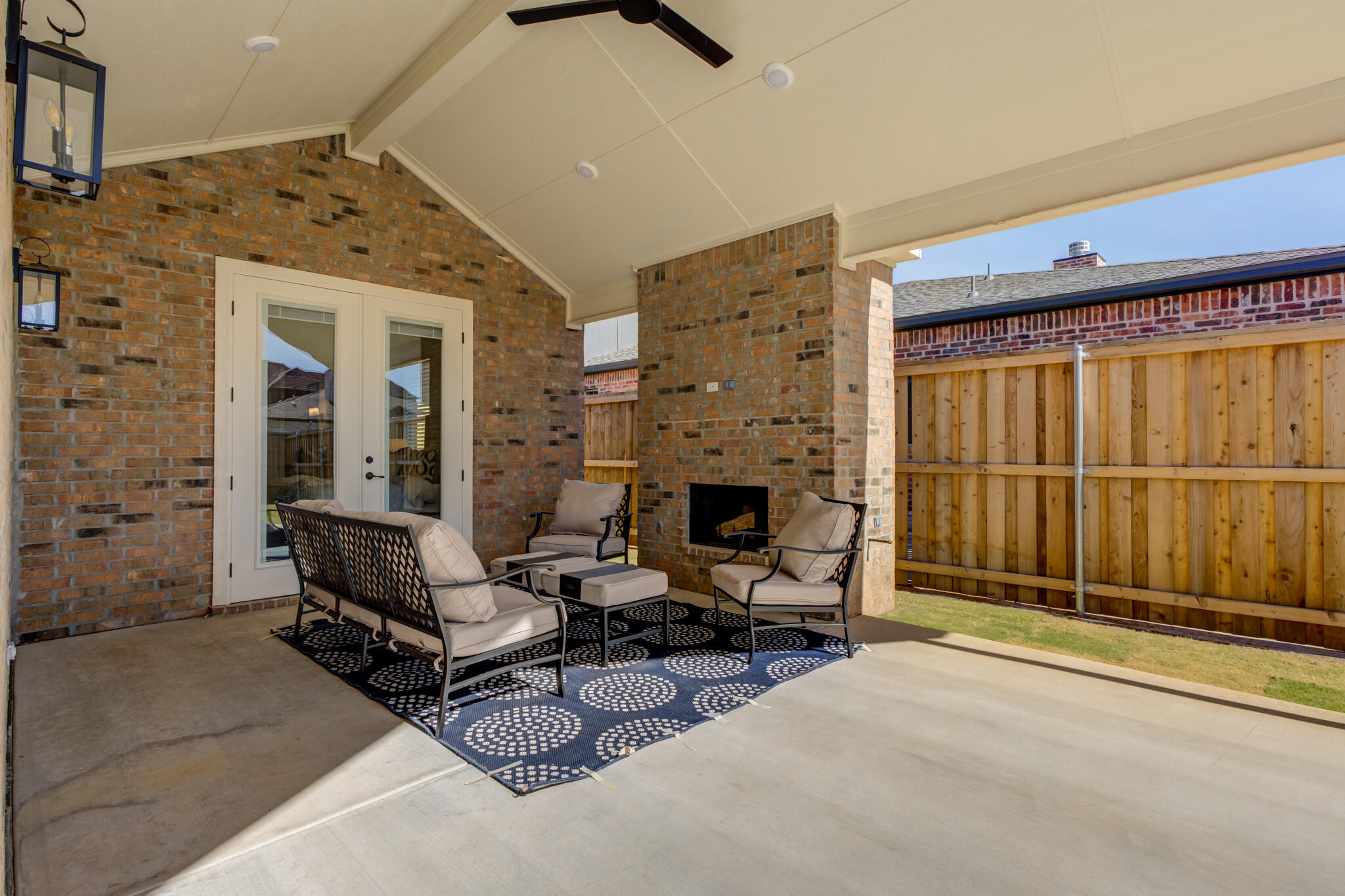 3809 126th Street Lubbock, TX 79423 - Photo 55 of 58 a living room with furniture a fireplace and a table