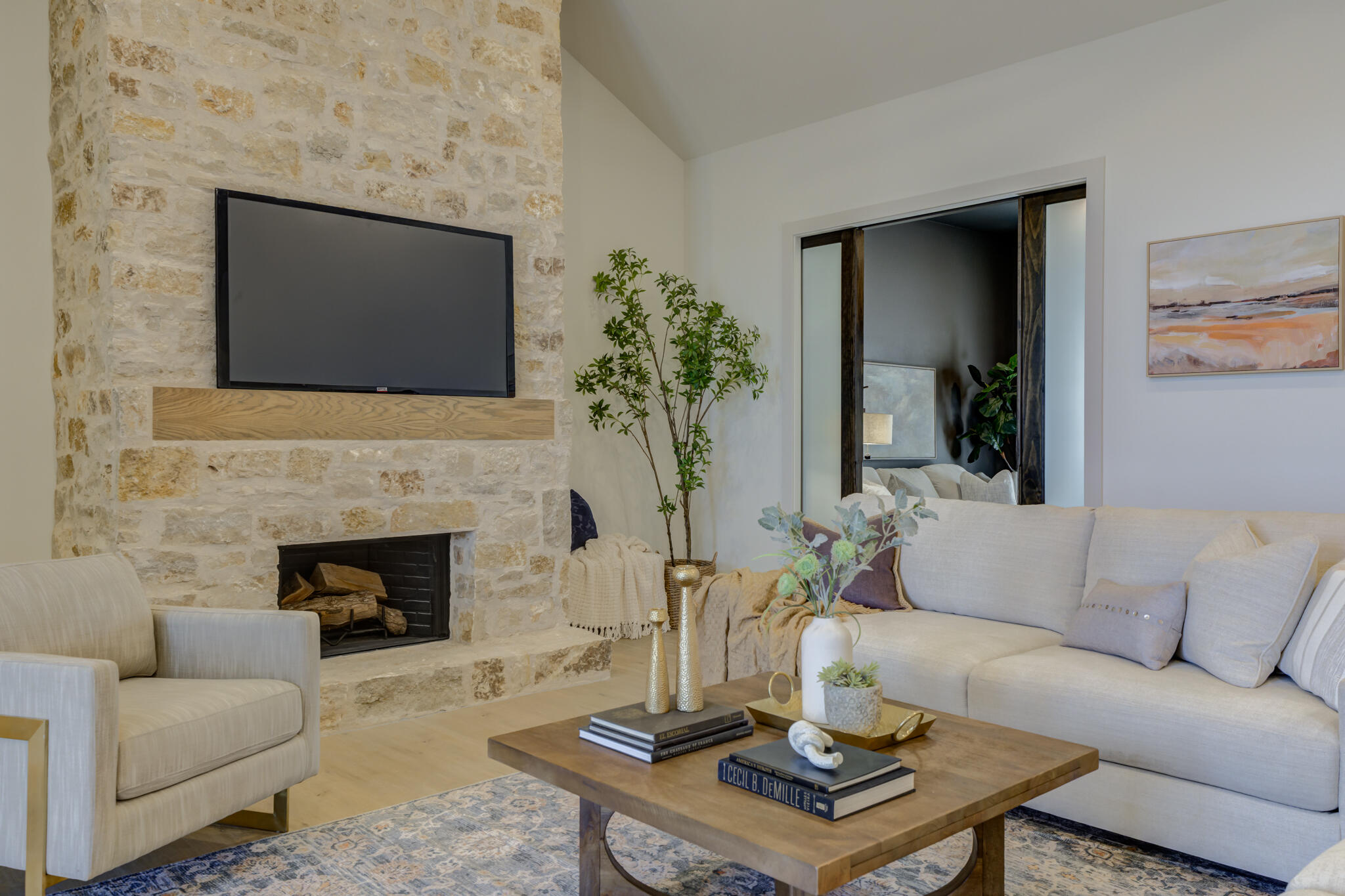 3809 126th Street Lubbock, TX 79423 - Photo 6 of 58 a living room with furniture a fireplace and a flat screen tv