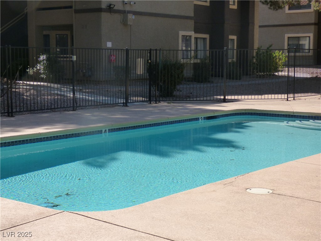 5044 South Rainbow Boulevard, Unit 106 Las Vegas, NV 89118 - Photo 15 of 18 Community pool with enclosure