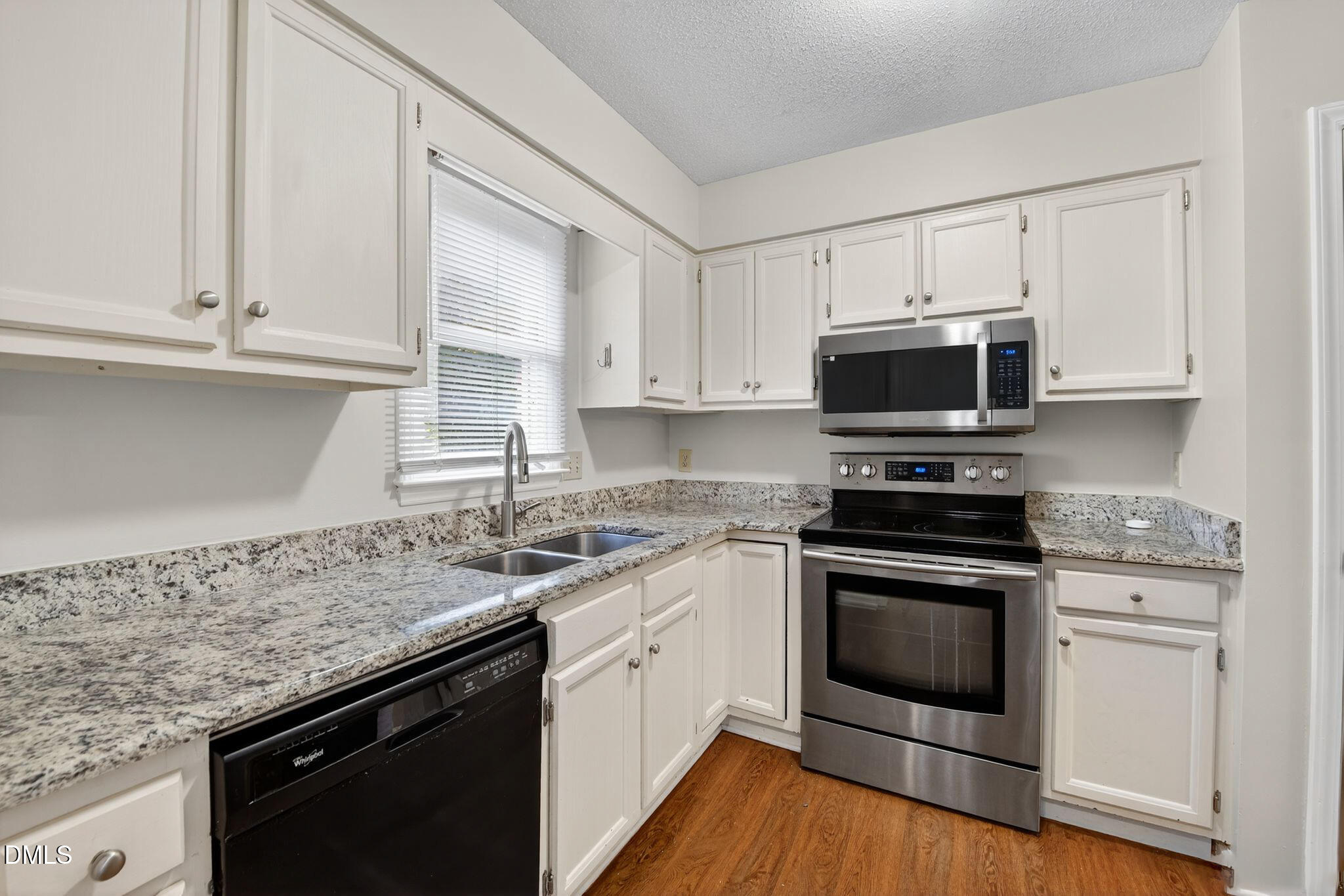 4131 Kaplan Drive Raleigh, NC 27606 - Photo 5 of 34 16_4131_Kaplan_Dr_Raleigh_NC_27606-Kitch