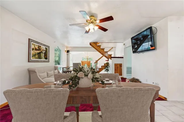 a dining room with furniture and window