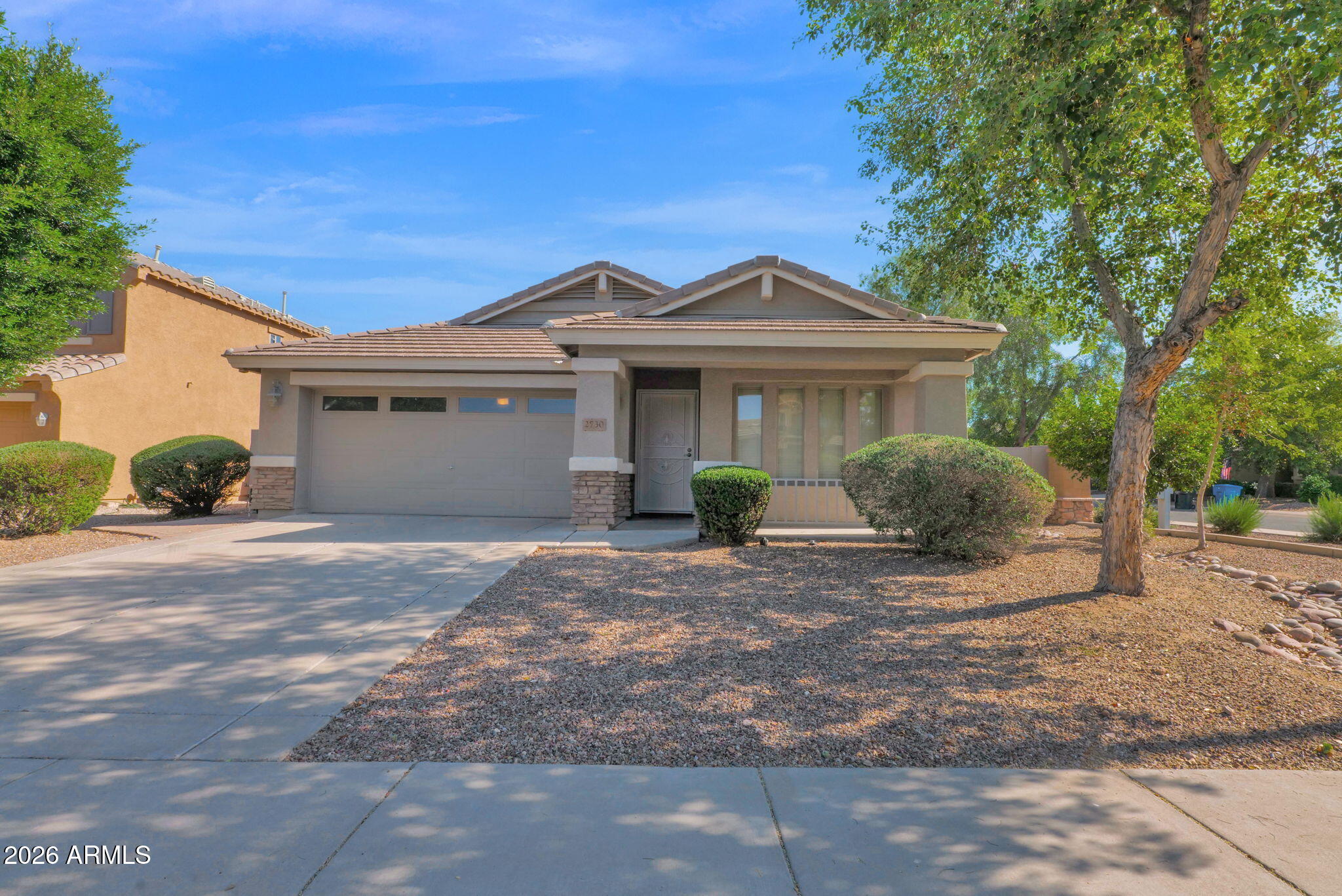 2730 East Dry Wood Road Phoenix, AZ 85024 - Photo 1 of 33 a front view of a house with a garden