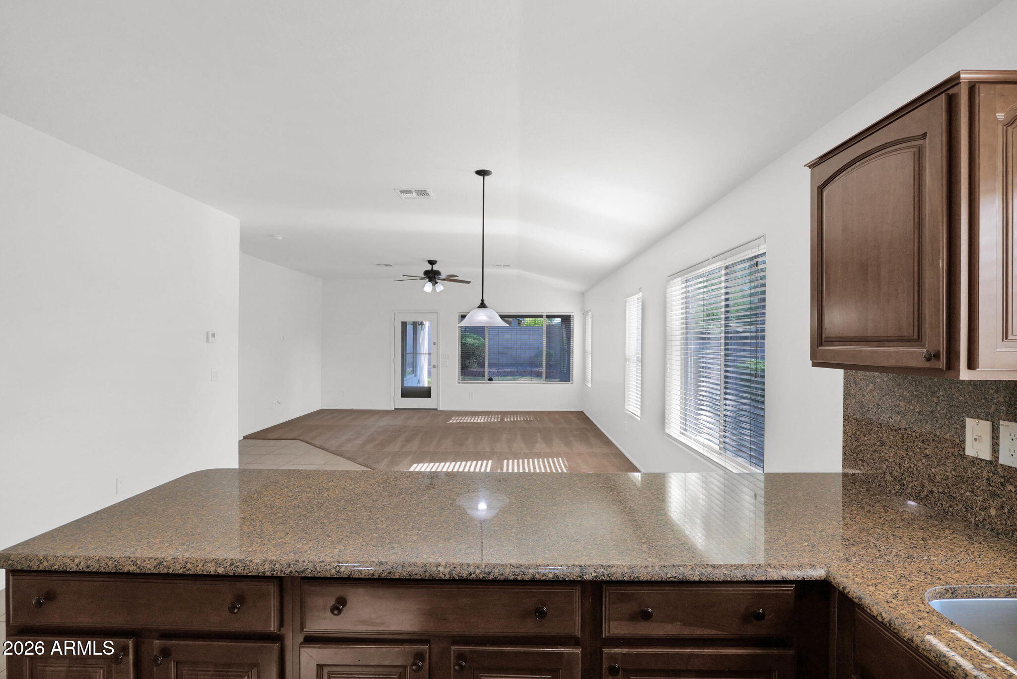 2730 East Dry Wood Road Phoenix, AZ 85024 - Photo 12 of 33 a view of kitchen with granite countertop a sink and a refrigerator