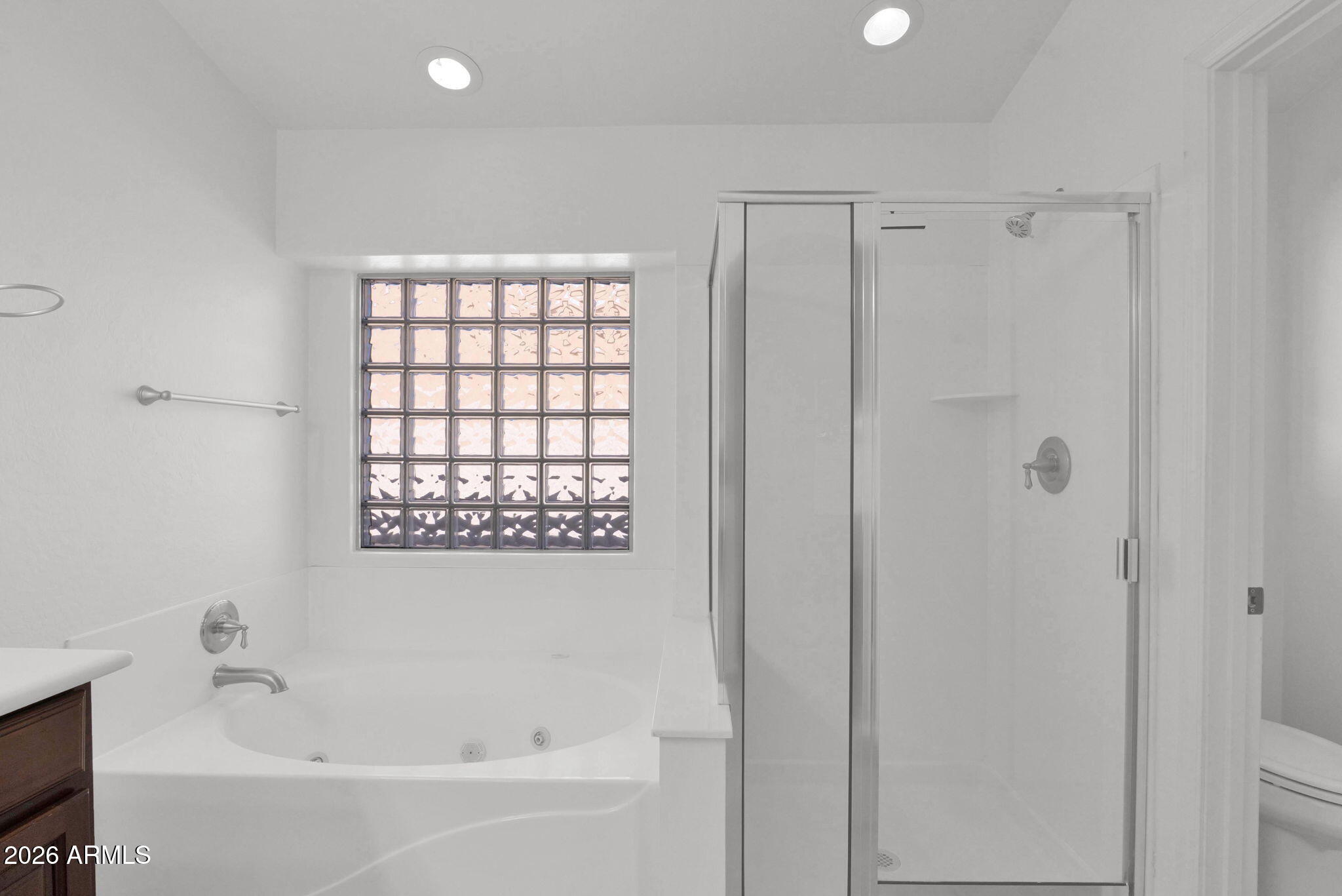 2730 East Dry Wood Road Phoenix, AZ 85024 - Photo 16 of 33 a white bath tub sitting next to a shower