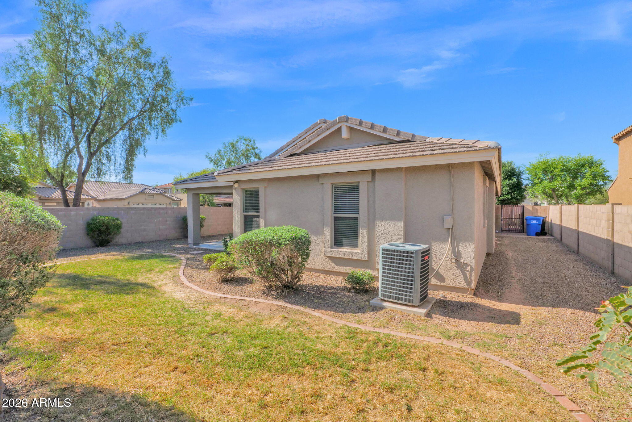 2730 East Dry Wood Road Phoenix, AZ 85024 - Photo 25 of 33 a front view of house with yard and trees in the background