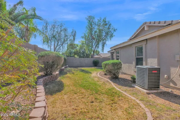 a view of a patio with table and chairs and potted plants