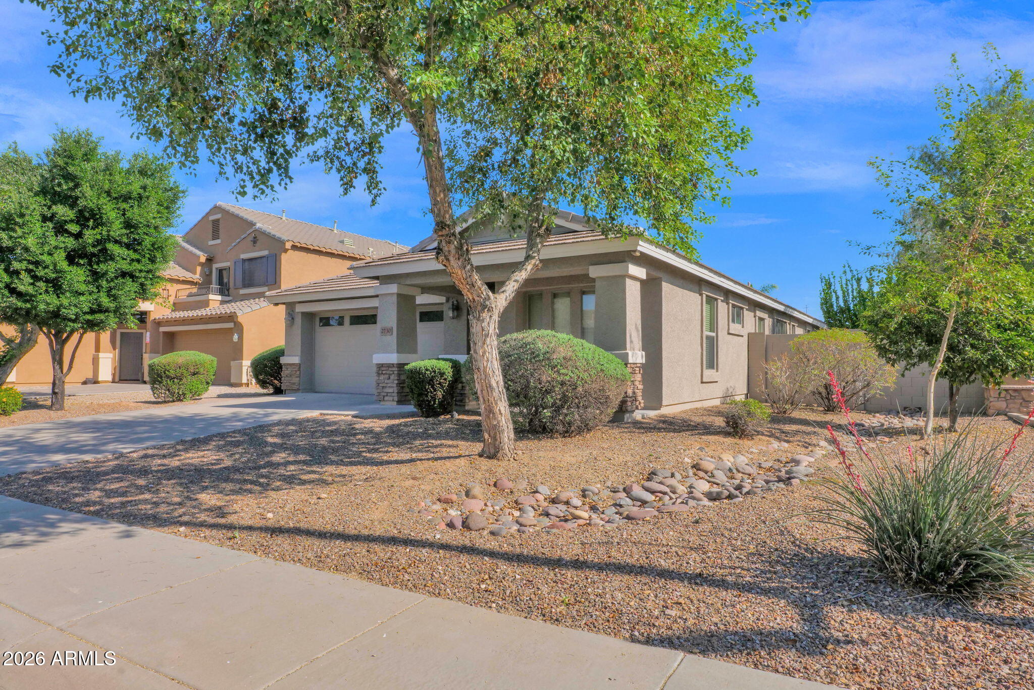 2730 East Dry Wood Road Phoenix, AZ 85024 - Photo 32 of 33 a view of a house with a tree in the background