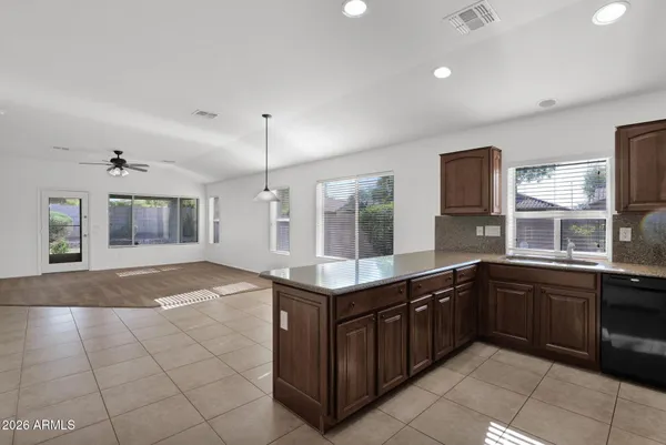 a kitchen with a sink and cabinets