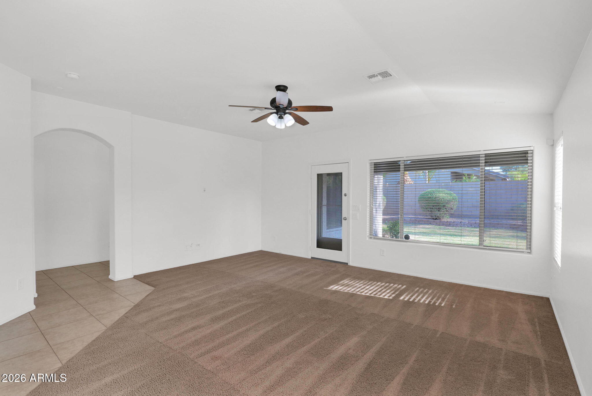 2730 East Dry Wood Road Phoenix, AZ 85024 - Photo 9 of 33 a view of an empty room with a window