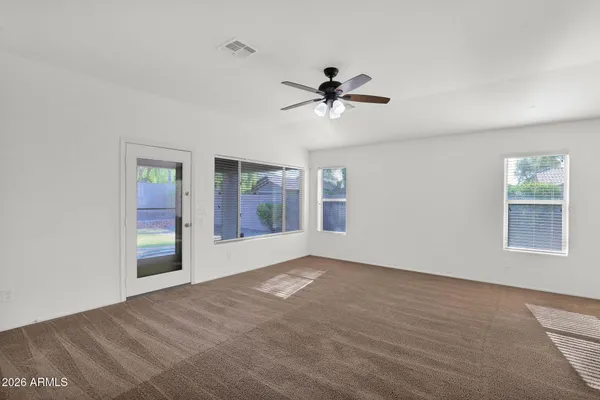 a view of empty room with windows