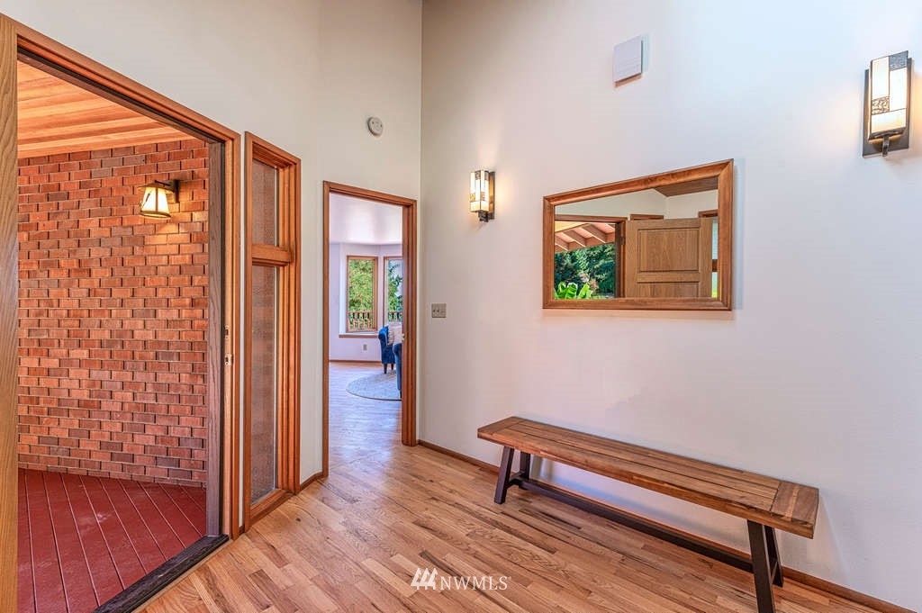19038 Ridge Road Southwest Vashon, WA 98070 - Photo 12 of 38 a view of a hallway with furniture and a window