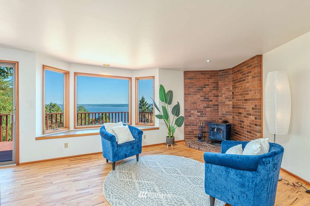 19038 Ridge Road Southwest Vashon, WA 98070 - Photo 14 of 38 a living room with furniture and a wooden floor
