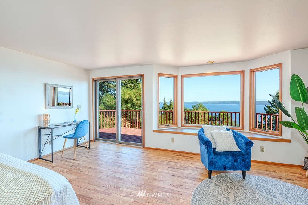 19038 Ridge Road Southwest Vashon, WA 98070 - Photo 15 of 38 a bedroom with furniture and a large window