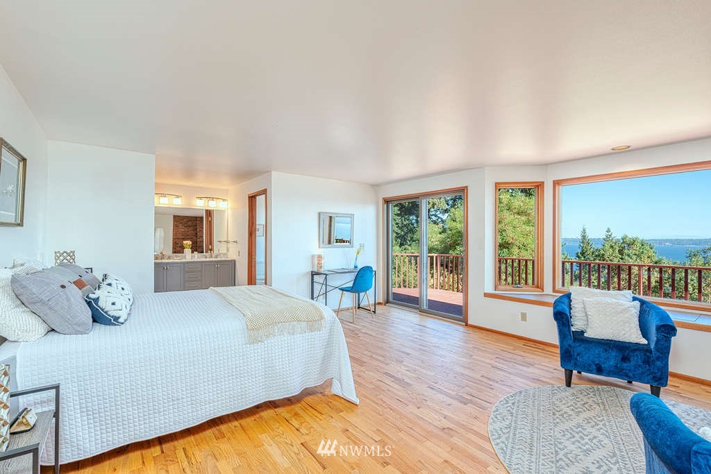 19038 Ridge Road Southwest Vashon, WA 98070 - Photo 16 of 38 a bedroom with furniture and wooden floor