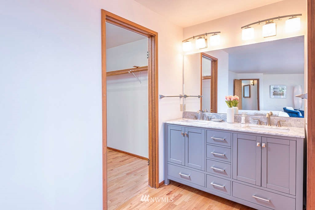19038 Ridge Road Southwest Vashon, WA 98070 - Photo 18 of 38 a bathroom with a granite countertop sink and a mirror