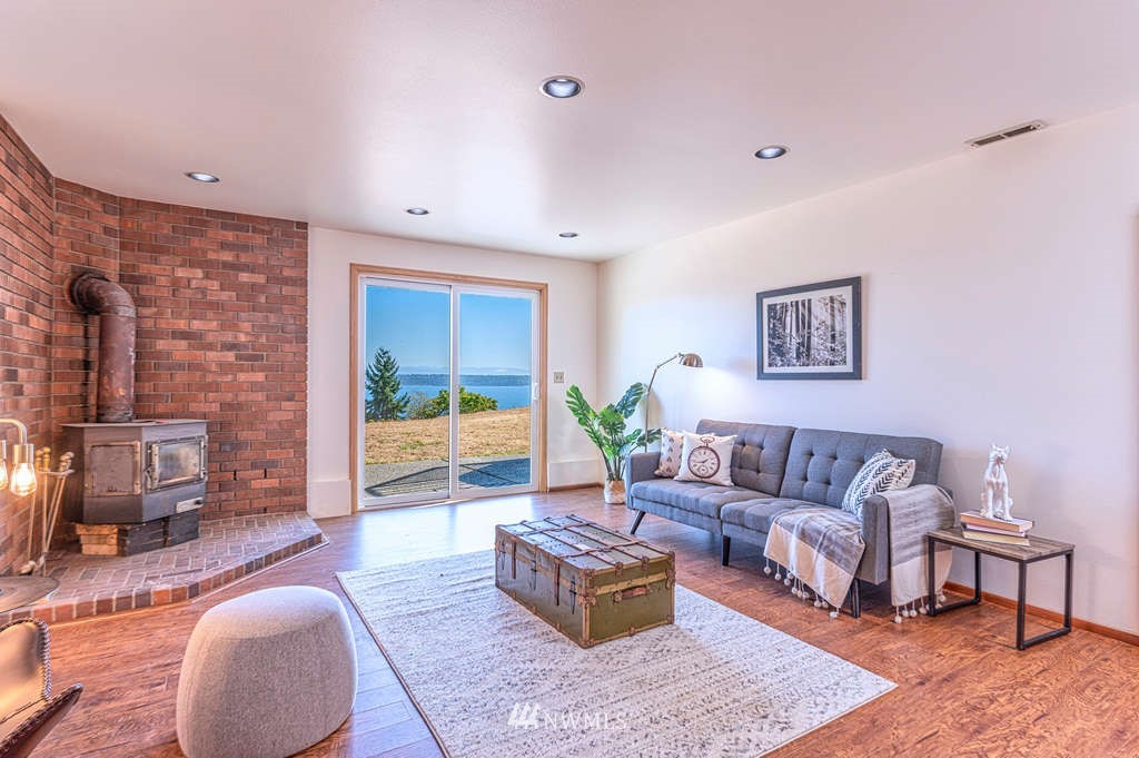 19038 Ridge Road Southwest Vashon, WA 98070 - Photo 23 of 38 a living room with furniture and a large window
