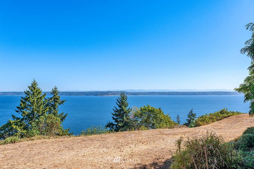 19038 Ridge Road Southwest Vashon, WA 98070 - Photo 29 of 38 a view of a lake and mountain in the back