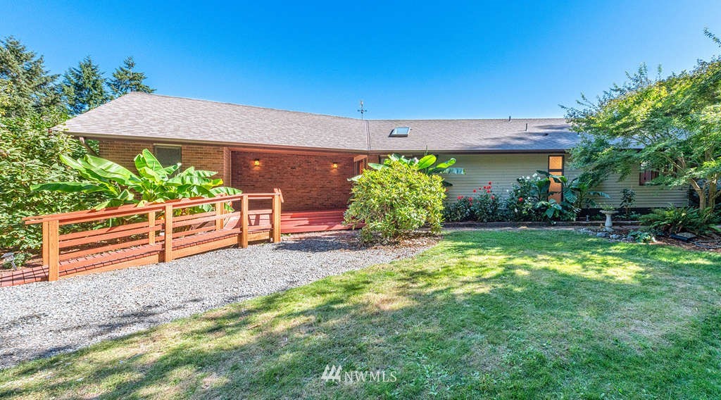 19038 Ridge Road Southwest Vashon, WA 98070 - Photo 31 of 38 a view of a backyard with a garden