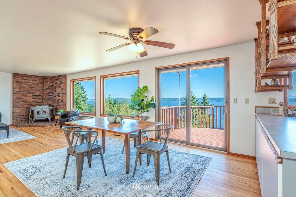 19038 Ridge Road Southwest Vashon, WA 98070 - Photo 6 of 38 a view of a dining room with furniture window and wooden floor