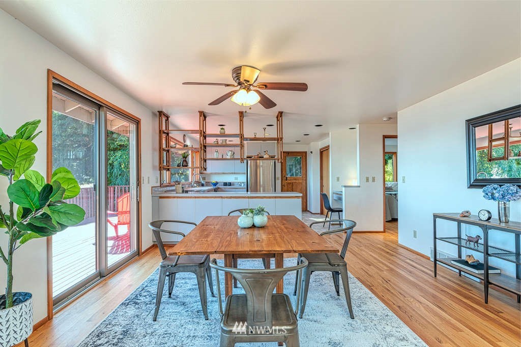 19038 Ridge Road Southwest Vashon, WA 98070 - Photo 8 of 38 a view of a dining room with furniture window and wooden floor