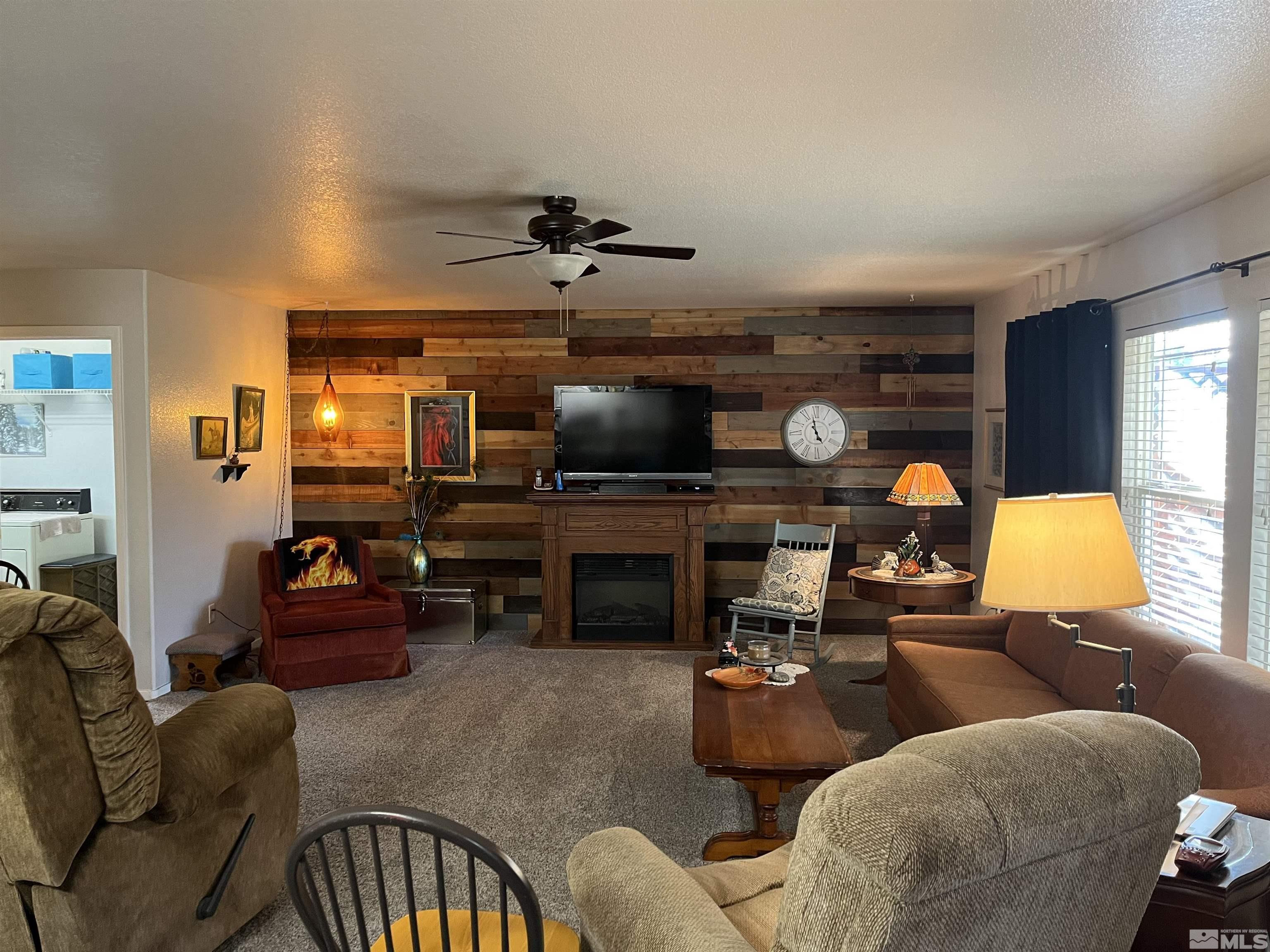 7871 Tulear Street Reno, NV 89506 - Photo 3 of 29 a living room with furniture and a flat screen tv