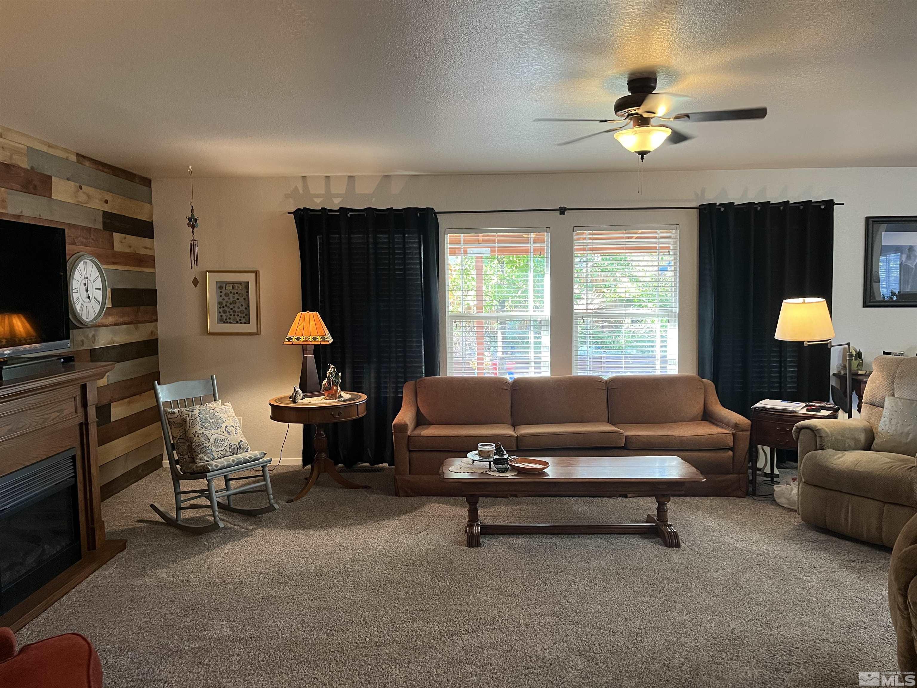 7871 Tulear Street Reno, NV 89506 - Photo 5 of 29 a living room with furniture and a flat screen tv