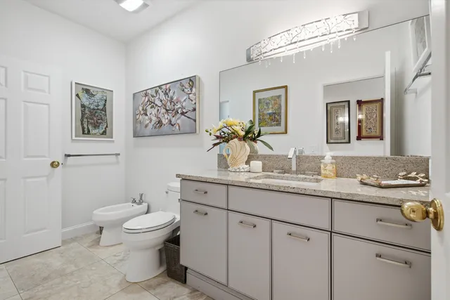 an aerial view of a house with a swimming pool outdoor seating and yard