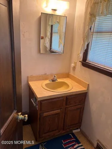 a bathroom with a sink and a mirror
