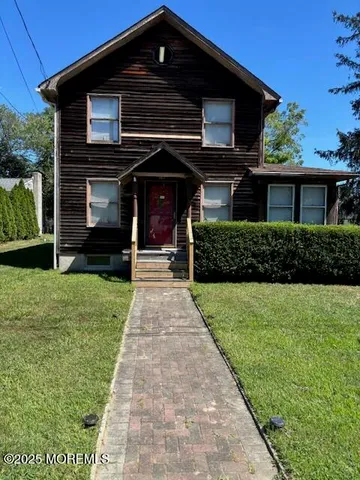 a front view of a house with a yard